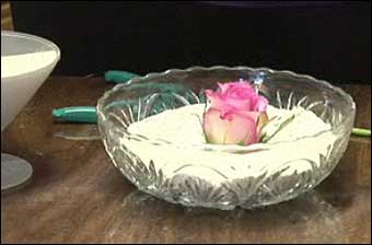 Dried Flower Arrangements - A rose petal drying in sand