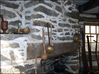 Swedish Cabin - The corner fireplace in the Swedish Log Cabin